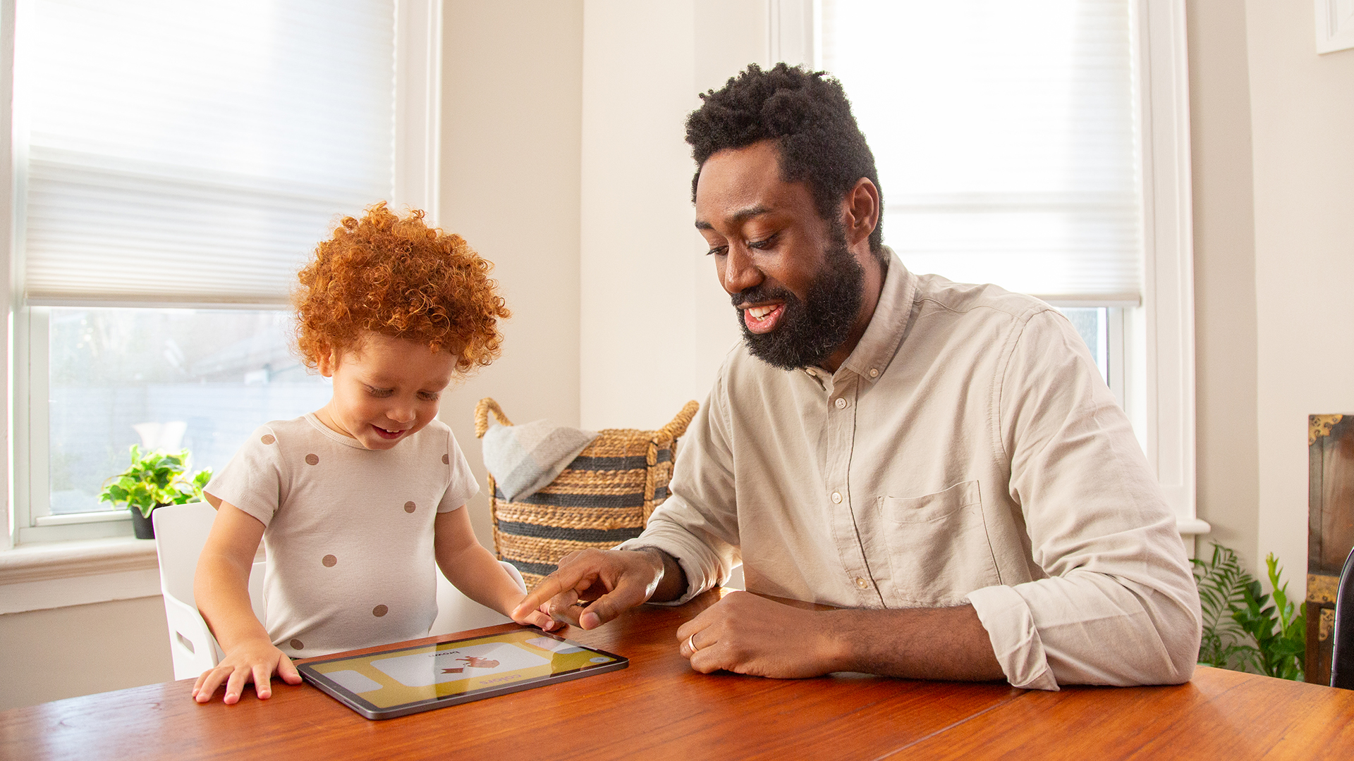 Father and son playing Sago Mini First Words